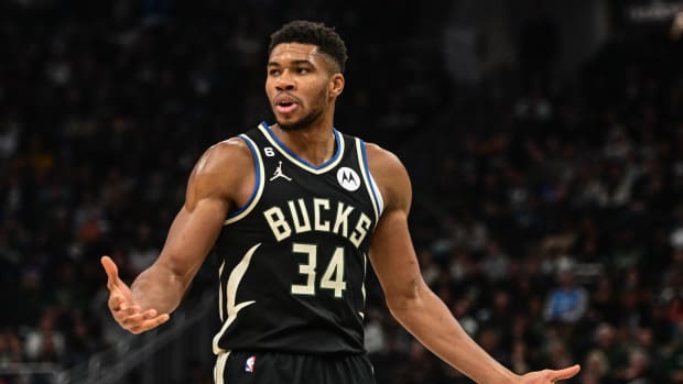 Giannis Antetokounmpo reacts after a foul call.